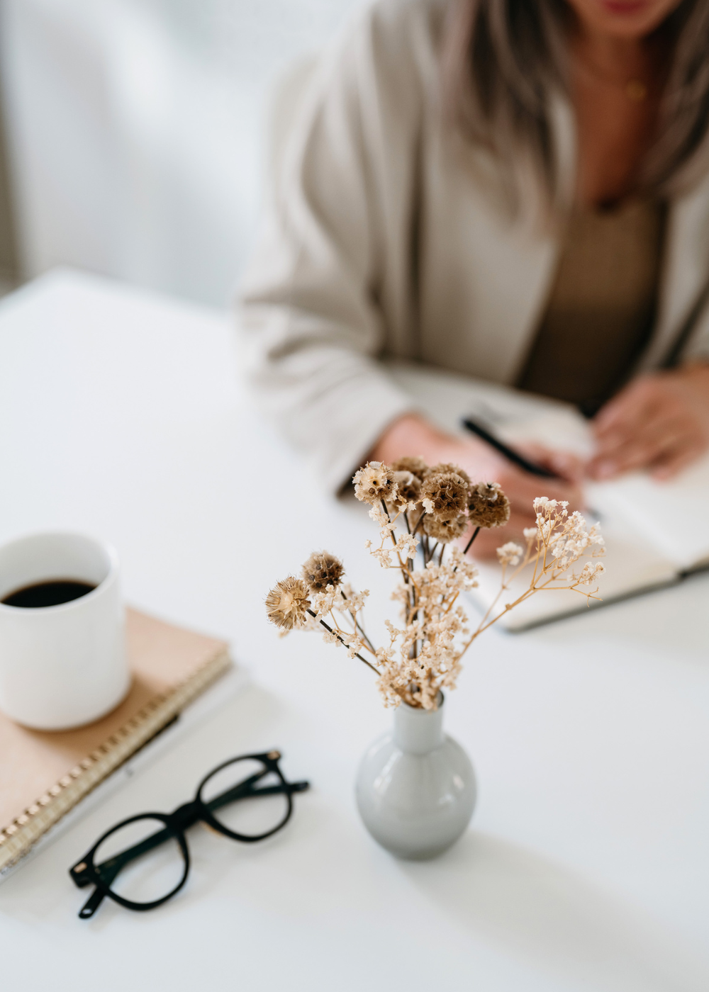 caucasian older woman writing in her journal