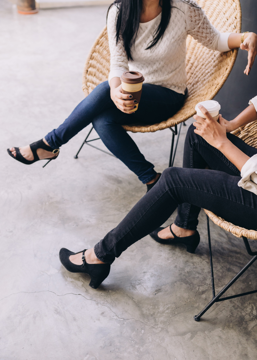 latina and african american women talking over coffee