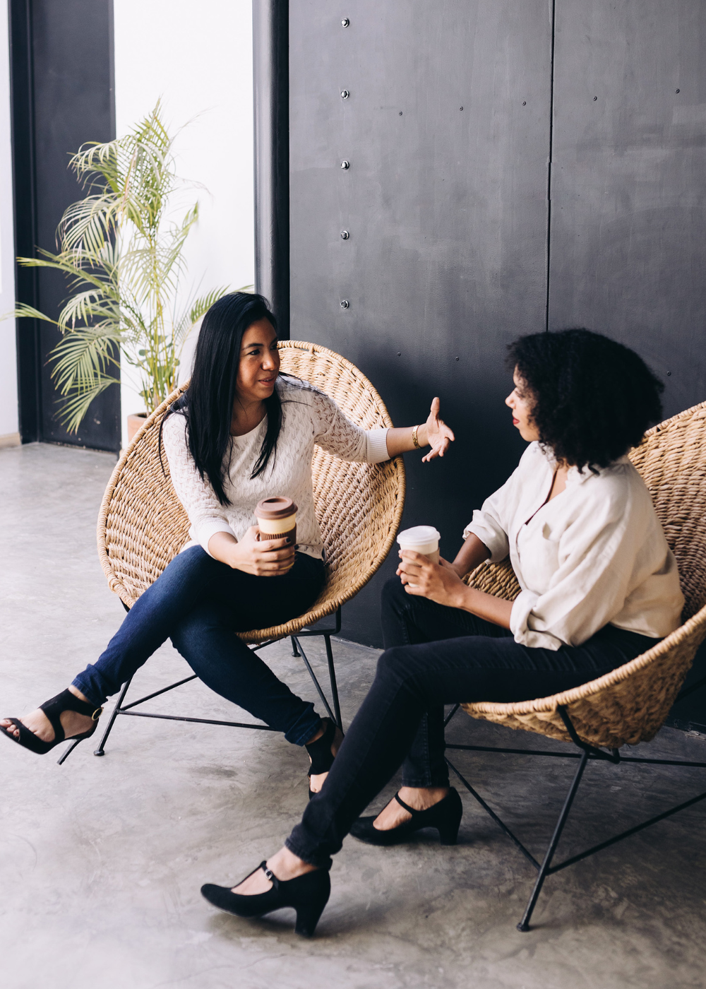 two women talking while having coffee